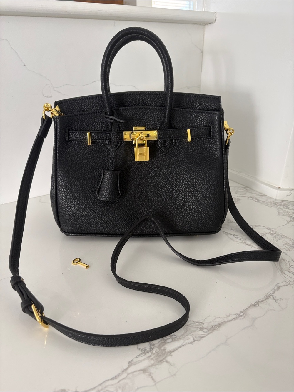 Structured Black Leather Satchel with Gold Lock Detail